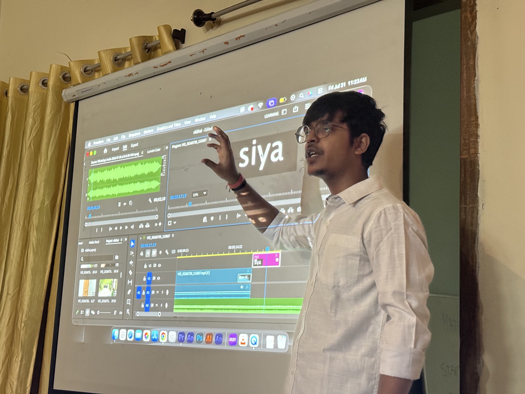 A facilitator discussing an editing timeline at Deeksha Foundation